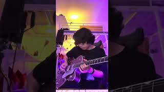 Messing around with a pink guitar under pink lights