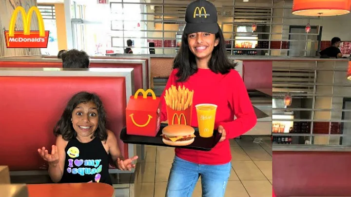 Kids pretend play working at McDonald's with surpr...