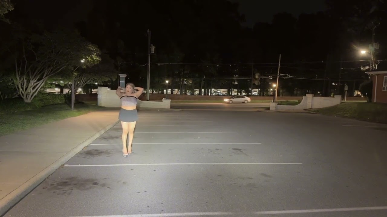 Crossdresser walking by busy street