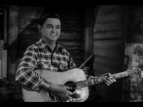 Merle Travis performs Nine Pound Hammer and Mus'rat.