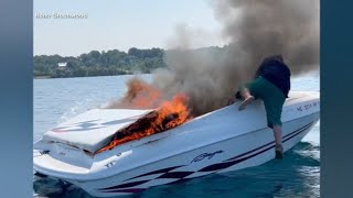 'It's gonna blow': Video captures dramatic moment family rescues 2 from boat engulfed in flames