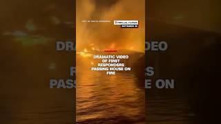 Dramatic footage of first responders passing house on fire