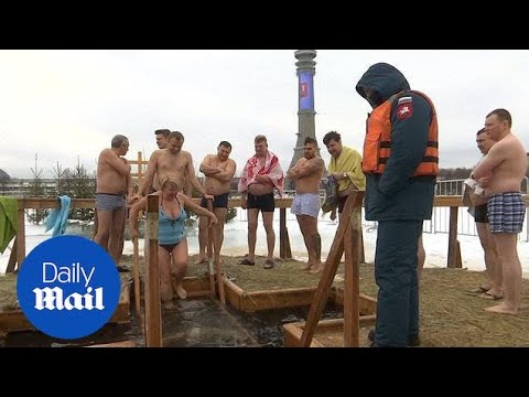 Russian Orthodox Christians plunge into icy water to mark Epiphany