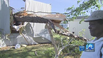 Tree crashes onto mobile home in EC