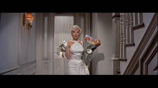 Marilyn Monroe gets her fan caught in the door in the movie Seven Year Itch