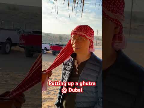 Putting up a ghutra at Dubai Desert Conservation Reserve