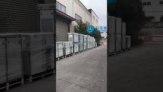 A long line of rotary screw air compressors waiting outside our factory for container loading