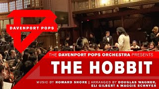 The Hobbit – DPops
If you liked this concert, please drop a like + subscribe to our channel! Thank you ♥
The Hobbit
Music by Howard Shore
Arr. Elias Gilbert ‘24 & Maggie Schnyer ‘24
with sections adapted from Douglas Wagner
Conducted by Maggie Schnyer ′24
ABOUT THE WORK
The Hobbit, or There and Back Again, was a novel originally published by J.R.R. Tolkien in 1937 and later inspired the creation of its sequel series, The Lord of the Rings, in 1954. The story follows hobbit Bilbo Baggins and his treacherous journey to reclaim the kingdom of Erebor with the help of a wizard and some other friends. The movie adaptation of The Hobbit: An Unexpected Journey (2012) features a soundtrack written and conducted by Howard Shore, a Canadian composer best known for his scoring of all the films in The Lord of the Rings and Hobbit series.
The arrangement opens with the iconic theme of “Old Friends” played on clarinet. The upbeat transition in “The Adventure Begins” features the same theme, this time in a waltz-feel. It’s passed on a third time to the penny whistle, a nod to “Concerning Hobbits” from The Fellowship of the Ring. “Misty Mountains” highlights the lower instruments of the orchestra with a tuba and euphonium solo over droning cellos and violas. The full orchestra is used to create a wall of sound in “An Ancient Enemy” as both this piece and “Riddles in the Dark” build to the climactic “A Thunder Battle.” Victory is achieved in “A Good Omen” and peace is restored with the return of the penny whistle in “Dreaming of Bag End.” The finale of the piece recalls themes from “Misty Mountains” and “Riddles in the Dark” with re-orchestration.
~ Maggie Schnyer 24 The Hobbit – DPops