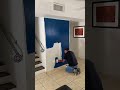 Interior Wall Painting Applying Deep Blue Paint with a Brush