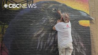 Mural artist Archer spraying character into back alleys and on barn doors across B.C. this summer