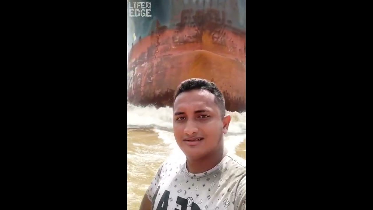 Tiny Boat In Front Of Cargo Ship Shorts