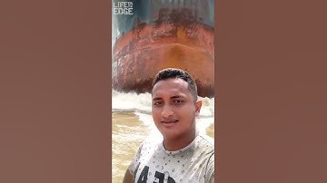 Thumbnail of Tiny boat in front of cargo ship #shorts