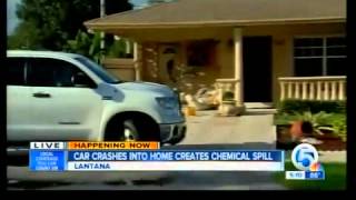 Car crashes into home, creates chemical spill