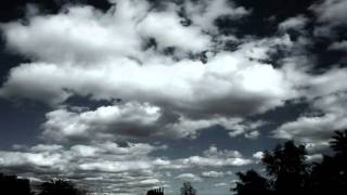 Long-run cumulus clouds forming/passing in pale blue sky timelapse HD V08943