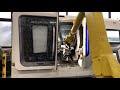DMG MORI NLX1500 loaded by FANUC Robot with 7th Axis.