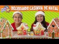 Maria Clara e JP decoram casinhas de biscoito para o Natal