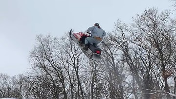 Larry Enticer Jumps Over Bus On Snowmobile
