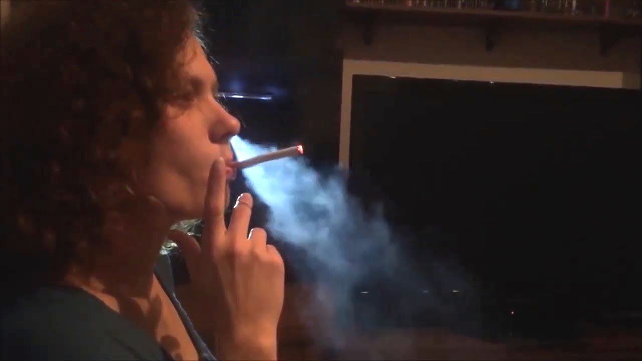 Woman smokes heavily