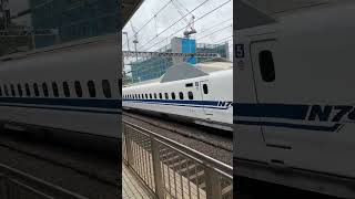 Shinkansen (Bullet Train) Speeding Through A Station