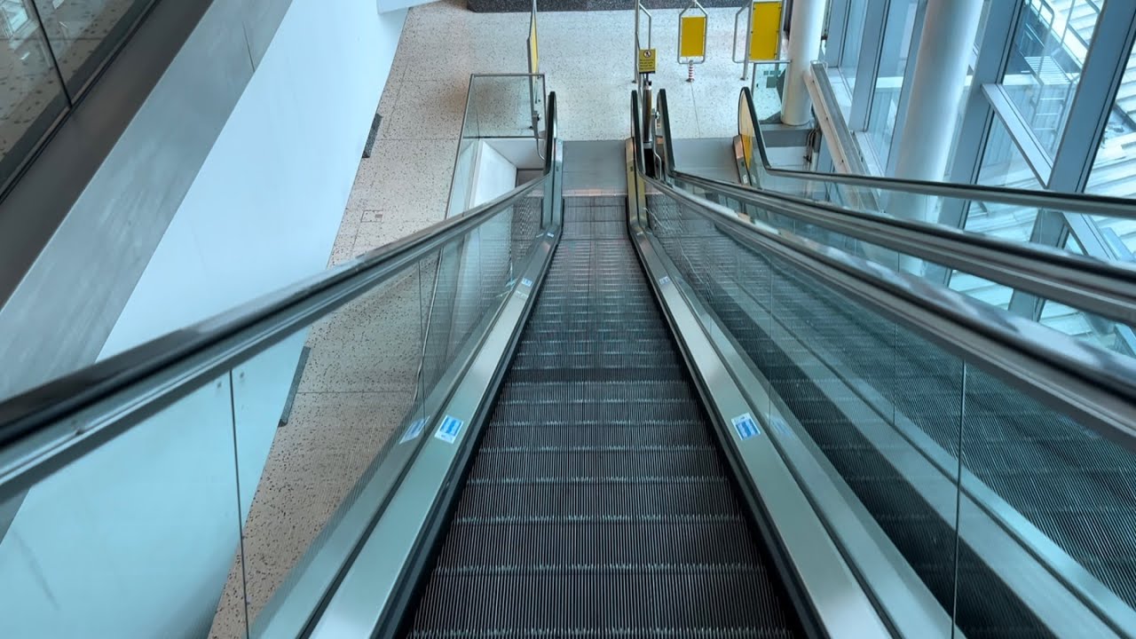 Manchester Airport - 4x Escalator ride around the Airport railway station building between terminals