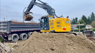 Excavator Loading Dump Trucks