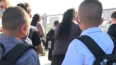 Vegas officers walk boy to school after his father...