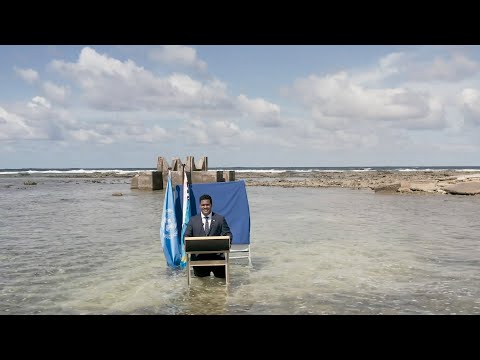 Tuvalu minister delivers speech to COP26 knee-deep in water, ''we are sinking', he says