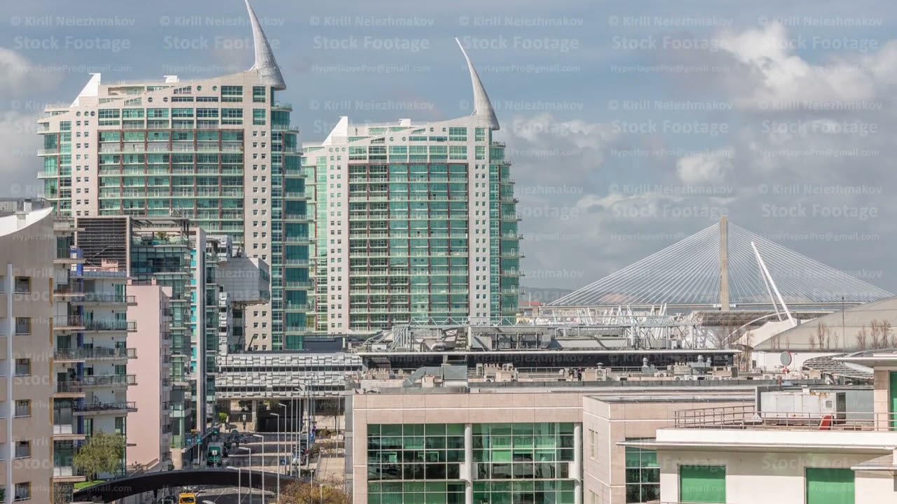 The Parque das Nacoes or Park of Nations modern neighborhood with skyscrapers aerial timelapse in