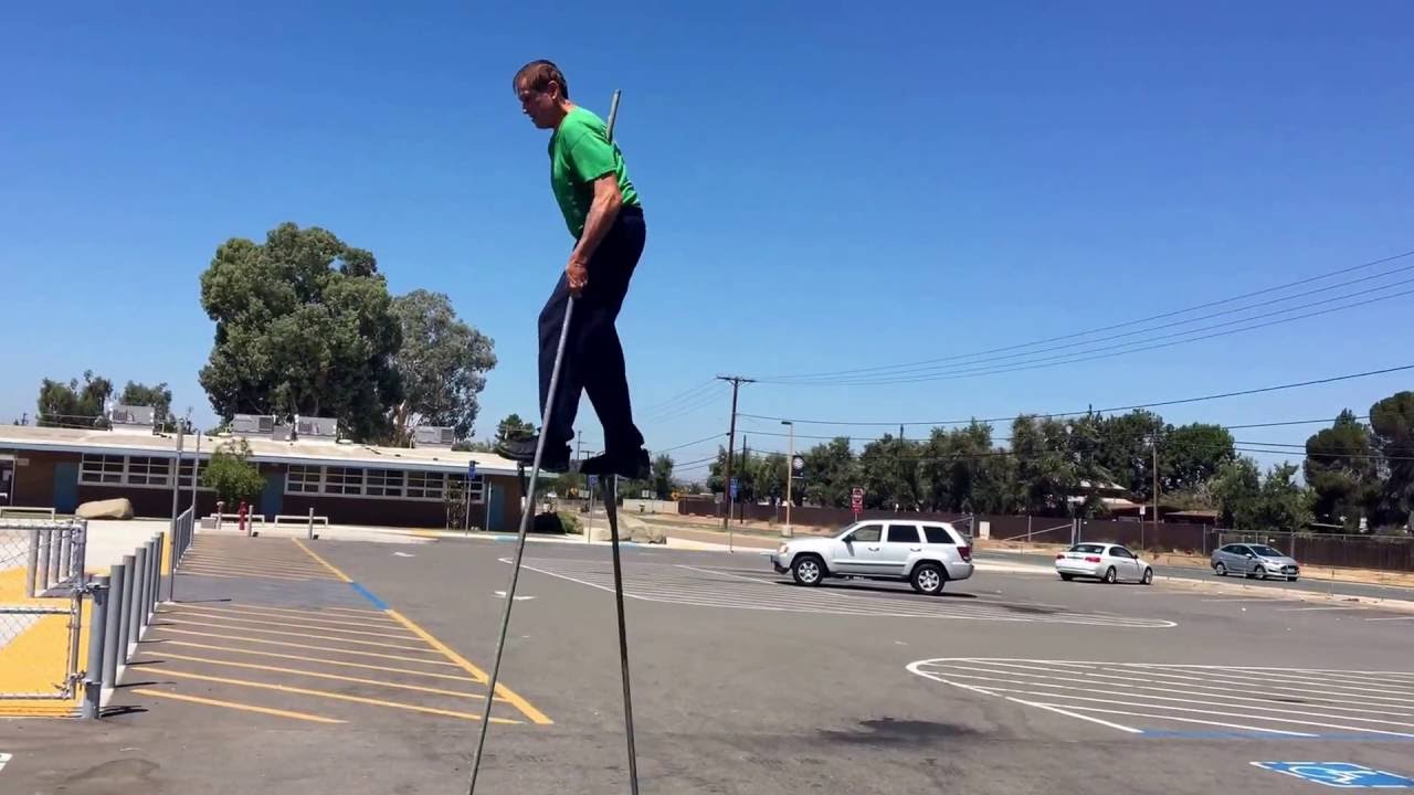 Rodger Monette walking on stilts with the greatest of ease