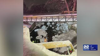 Car slides off bridge into Ashland river, driver uninjured