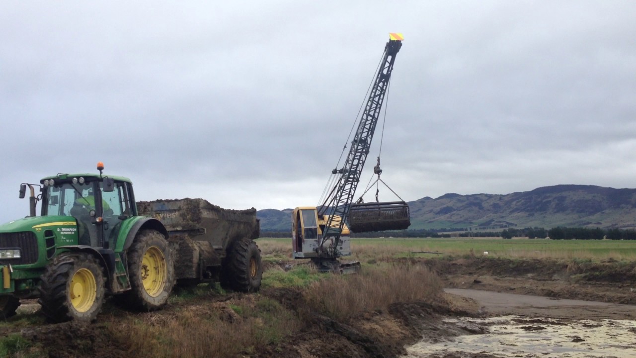 Dragline cleaning effluent pond in northern Southland NZ YouTube