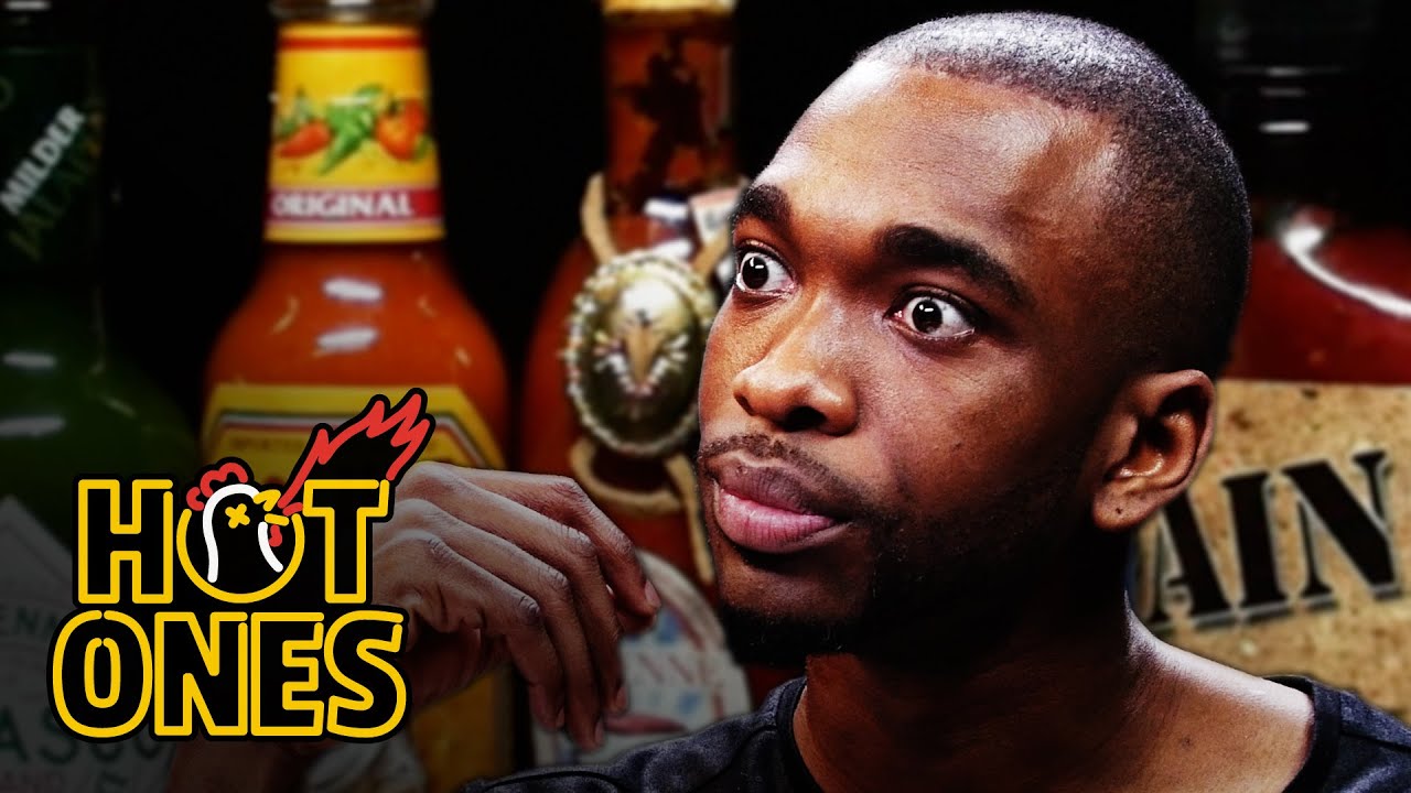 Jay Pharoah Has a Staring Contest While Eating Spicy Wings | Hot Ones | First We Feast