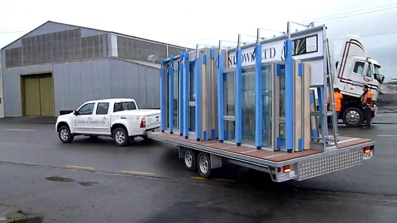 The Glass Racking Company 6M window trailer loaded and being towed