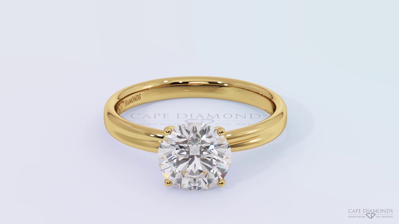 Twisted crossover four claw engagement ring setting yellow gold