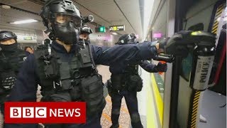 Hong kong police have violently tackled suspected protesters after
thousands of people marched in the city defiance a ban. images show
hitting p...