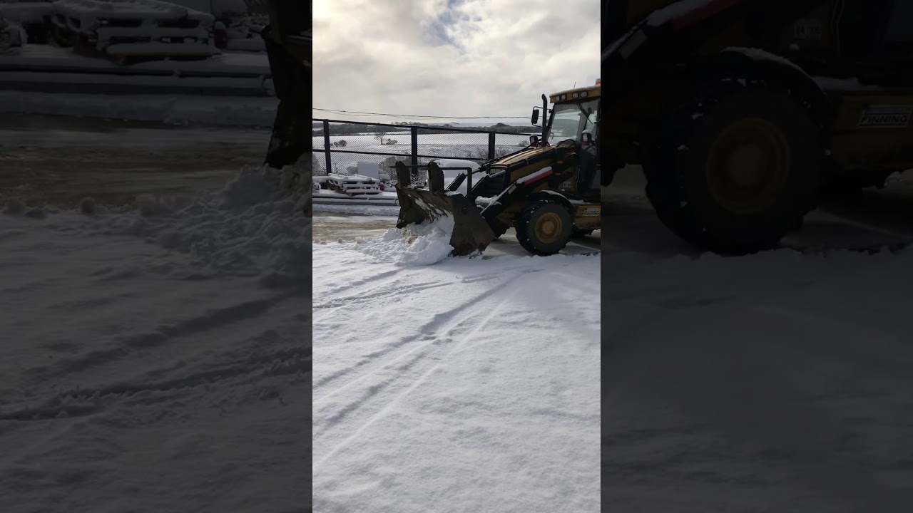 CAT 438C pushing snow - YouTube