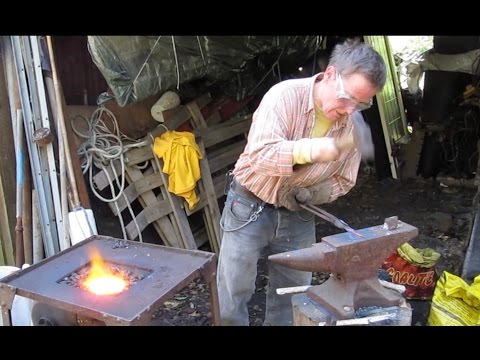 Blacksmith forging knife blade