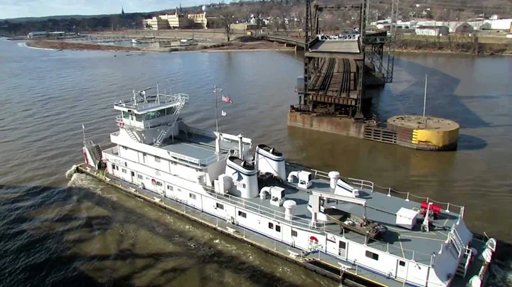 The M/V COOPERATIVE VENTURE passing through the Fort Madison, Iowa Swing Bridge