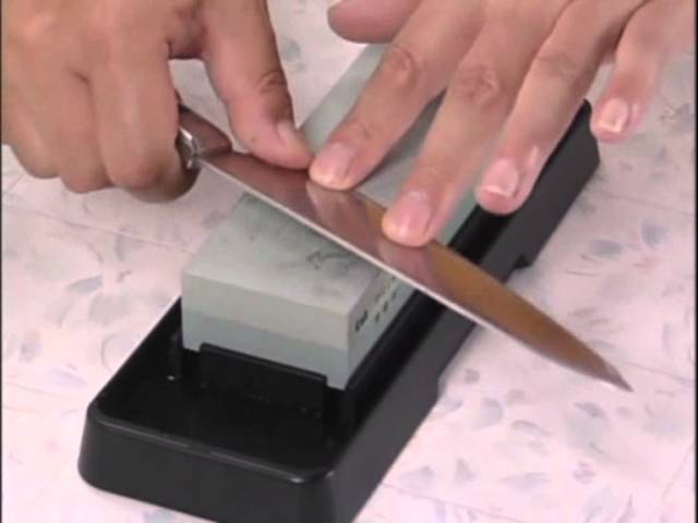 Sharpening a Kai Shun knife on a Kai whetstone 