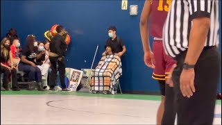 Getting a haircut during a school basketball game prank