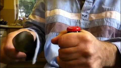 Open a beer bottle with a spoon