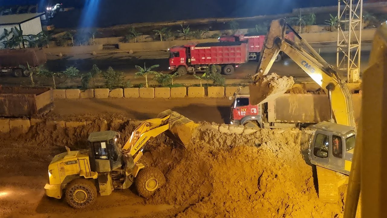 loaders and excavators work together to clean up the remaining ...