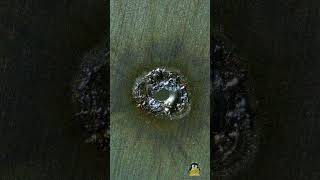 Preview of EDM drilling through a microscope