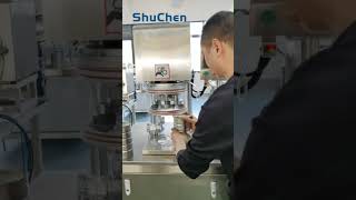 Vacuum can seaming machine
