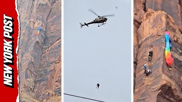 Helicopter Makes Incredible Maneuver to Rescue BASE Jumper Dangling From Canyon Wall