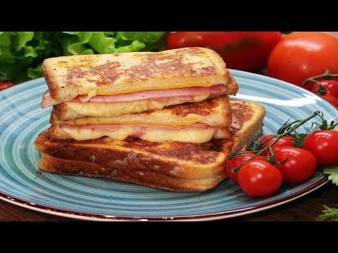 Hot sandwiches with ham and cheese on a frying pan