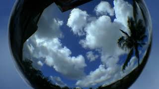 Lensball Clouds Timelapse - No Audio 4K Screensaver of Blue Skies and Cumulus inside Crystal Ball