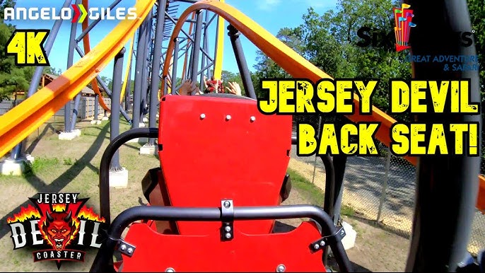 Jersey Devil Coaster, Six Flags Great Adventure], valleyed during a test  run. Visible from Nitro's lift hill is one of the Jersey Devil Coaster  trains valleyed in the dip before the mid-course