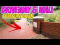 Power washing a driveway and steam cleaning a brick wall