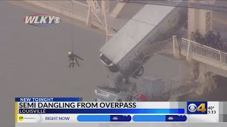 Semi dangles over side of bridge spanning Ohio River